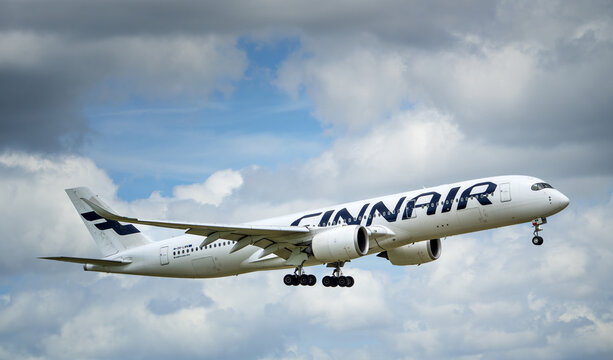 Finnair aircraft Airbus A350-900, approaching Dallas Fort Worth International Airport (DFW) from Helsinki, Finland. Storm clouds.