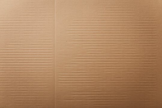 Close up of brown corrugated cardboard revealing its distinctive parallel lines and robust textured surface