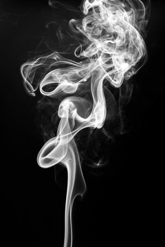 White smoke swirling and rising vertically on a solid black background.