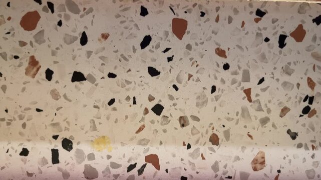 Side view of granite wall. background, backgrounds. copy space, empty, free, negative, text, design. marble. stone. texture, detail. bright, lamps, shadows, dark. floor. texture. close up.
