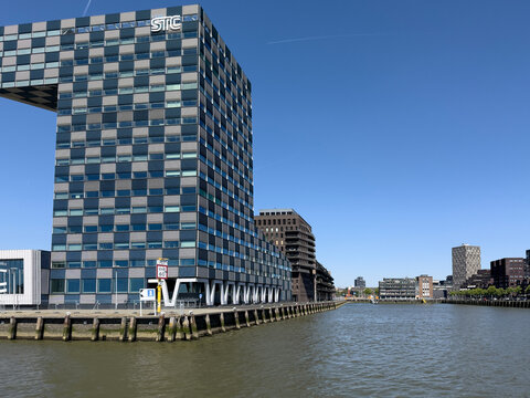 Modern STC waterfront building beside the Nieuwe Maas in Rotterdam Netherlands under blue sky