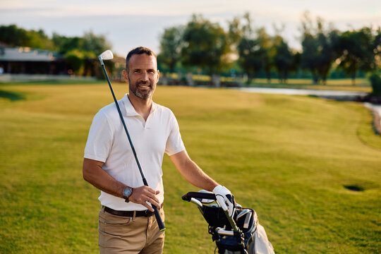 Happy golf player at the golf club looking at camera.