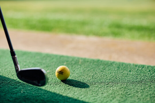 Close up of golf practice at driving range.