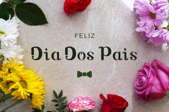feliz dia dos pais. greeting card with fresh flowers and natural light. copy space