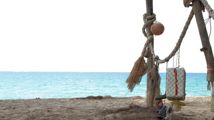 Rustic Fishing Floats and Ropes Hanging on a Phuket Beach © blueringmedia