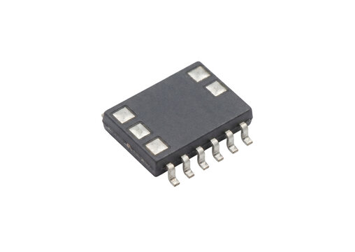 Small black electronic component integrated circuit chip with pins for computer motherboard.