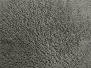 soft gray fleece fabric texture close up showing cozy soft fuzzy plush material background © Arthur