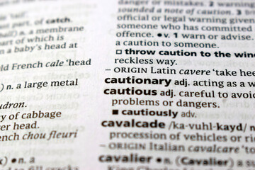 Fototapeta premium Detail Of English Dictionary Page And Word Pronunciation Of - cautionary