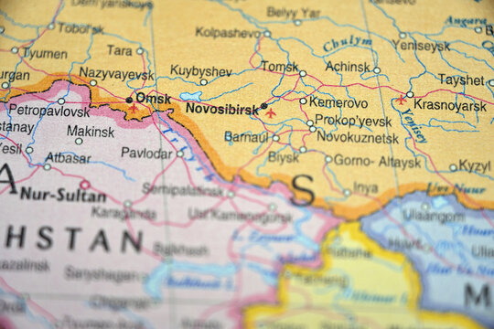 Novosibirsk Russia Highlighted on Blurred Global Map &ndash; Urban Siberian City Photo