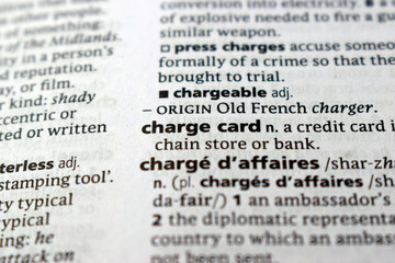 Fototapeta premium Close Up Of English Explanation Dictionary Page Word Of - charge card