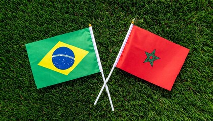 Fototapeta premium Brazil and Morocco flags side by side on grass, symbolizing unity, cultural pride, and international friendship in celebration.