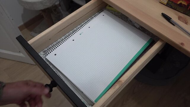 person opening a desk drawer. High quality 4k footage