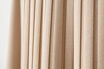 Obraz premium Close-up of Beige Pleated Curtains in Soft Lighting