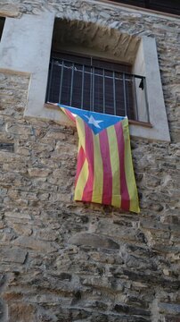 Catalan Independence Flag Hanging on a Stone Building. Estelada Flag Short Video.