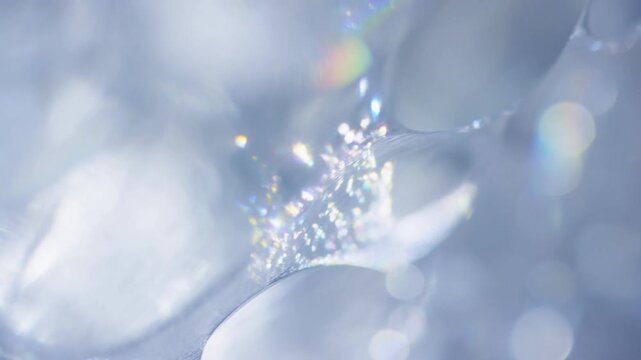 Abstract close-up of shimmering ice crystals reflecting light. Captivating visuals for winter themes, elegance, and beauty in nature