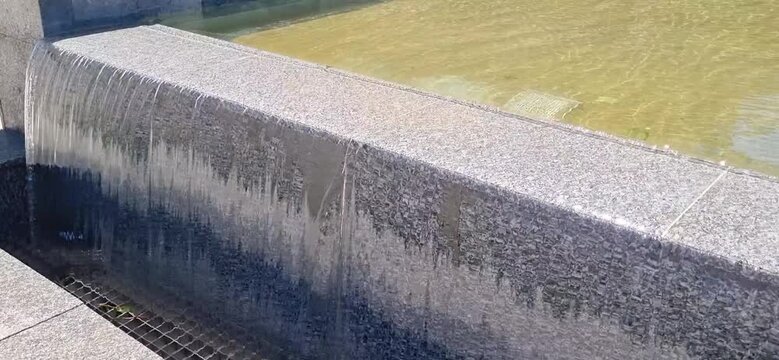 Water Flowing Through Granite Canal at the Entrance of First President Park in Kyzylorda