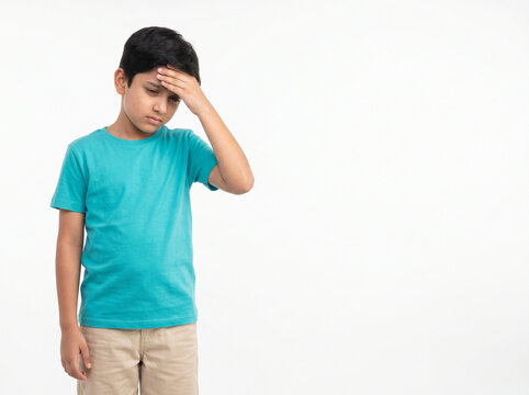 Young Indian school boy with headache and screen fatigue symptoms isolated on white background for pediatric healthcare awareness and wellness campaigns