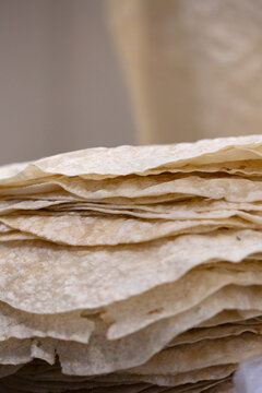 A close up view of stacked fresh flatbread