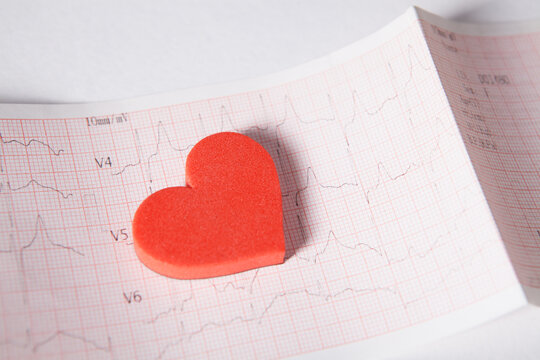 Red heart on the cardiogram. Cardiogram on white background