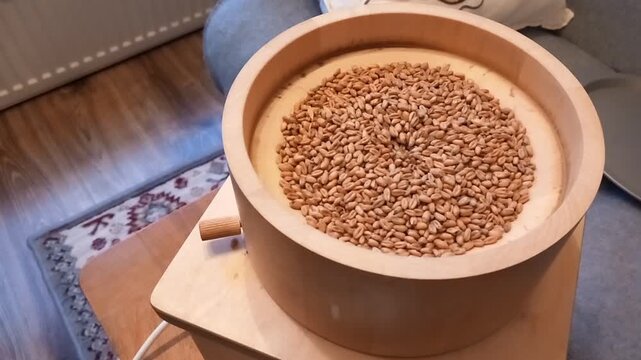 Stone grain mill grinding wheat and creating flour