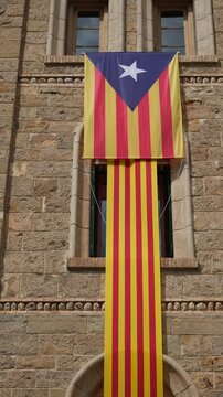 Catalan Independence Flag Hanging on a Stone Building. Estelada Flag Short Video.