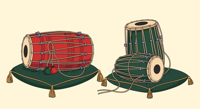 Traditional Indian percussion instruments including a dholak and a pair of tabla drums placed on ornate cushions for a musical performance.