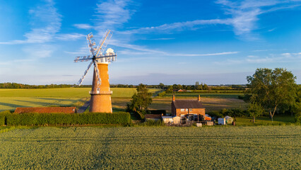 English Victorian historic structures, windmill at sunset, Fen Drainage, English countryside rural scene with windmill, Lincolnshire, UK. © MD Media