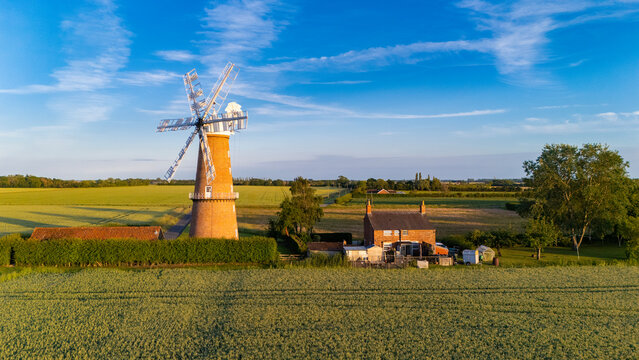 English Victorian historic structures, windmill at sunset, Fen Drainage, English countryside rural scene with windmill, Lincolnshire, UK.