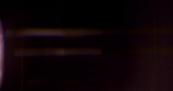 Slow motion cinematic lens flare and light leak effect isolated on black background. Perfect overlay for VFX, transitions, title reveals, film burn style and glow highlights.