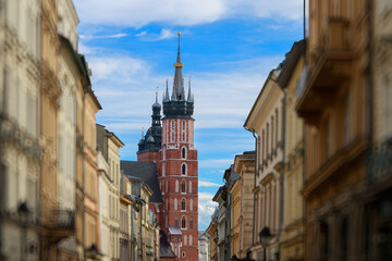 Obraz premium Krakow's historic town hall tower dominates a charming central alleyway