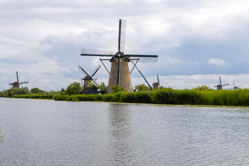 The famous windmills of Kinderdijk, in the Netherlands. The site is home to 19 historic 18th-century mills, lined along the canals. It is a UNESCO World Heritage site, famous for its water management  © faber121