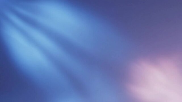Abstract blue and purple light rays creating a soft, ethereal glow across a gradient background with subtle highlights.