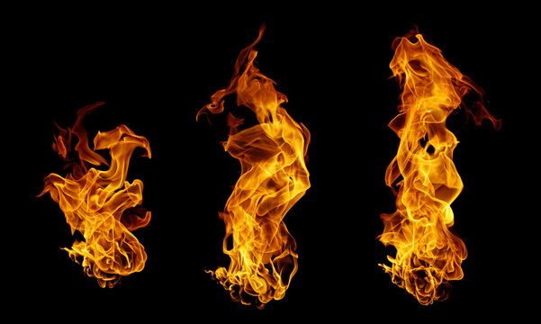 Abstract fire flames isolated on black background with glowing orange and yellow blaze. Dynamic flame shapes, heat energy, burning motion, wildfire concept, dramatic fire texture for design.