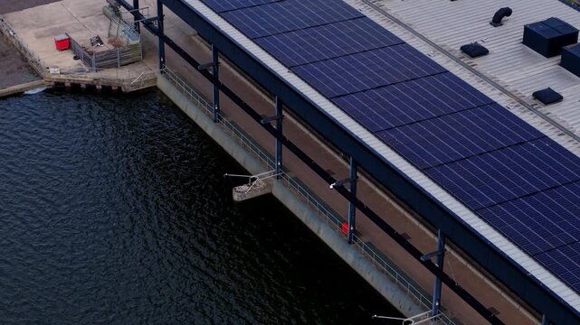 Close-up aerial view of St Germans Pumping Station pump house and river outfall channel, Norfolk, UK