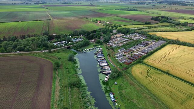 Aerial View of Stretham Marina with Narrowboats Moored on River Banks