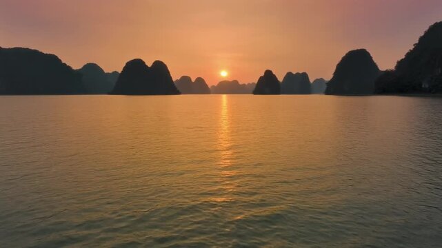 Tuyen Lam Lake aerial view during golden sunset over mountains