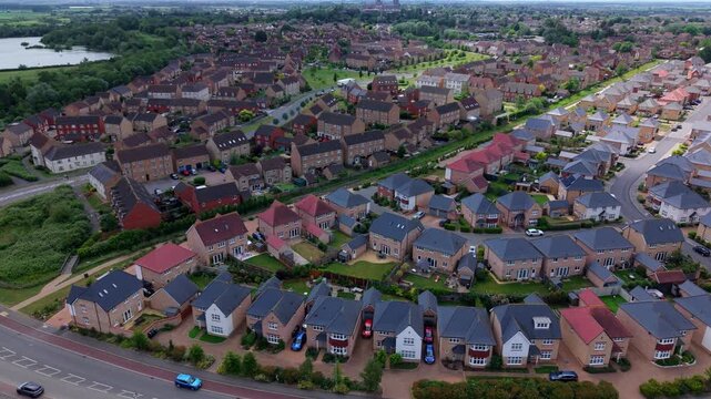 High angle view of residential housing expansion in Ely comparing new architectural designs with old neighborhood layouts