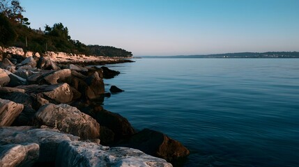 Obraz premium A tranquil panoramic view of the sea illuminated by crisp evening light