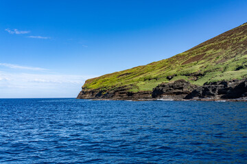 Fototapeta premium Niʻihau & Nāpali Coast Boat Tour, Kauai County, Hawaii, Pacific Ocean. Lehua Island ( Lehua Crater ) is Tuff cone. Ki‘eki‘e Basalt, NI‘IHAU VOLCANO. Lehua is a state-designated seabird sanctuary 