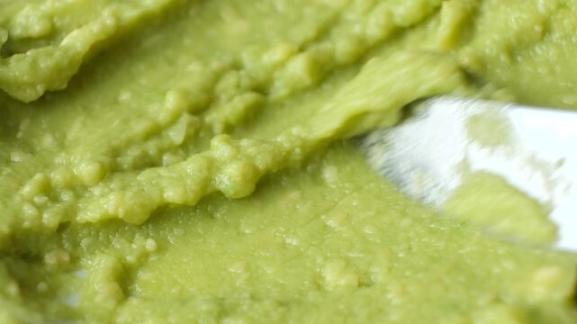 Texture of homemade traditional guacamole close-up