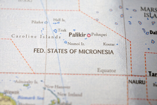 Nomoi Islands Location on World Map &ndash; Real Photo Style Selective Focus with Sharp Foreground and Blurred Background