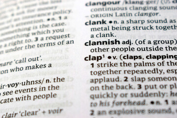 Fototapeta premium English Dictionary Page Close Up With The Word Transcription Of -clannish