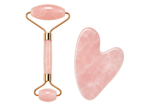 Rose quartz facial roller and gua sha tool isolated on transparent background for skincare routine