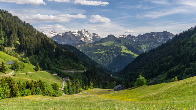 wonderful sight in the Grosswalsertal, clouds over the mountains in Austria, the view from Faschinajoch in Vorarlberg, Rote Wand (mountain called "the red wall") in the background