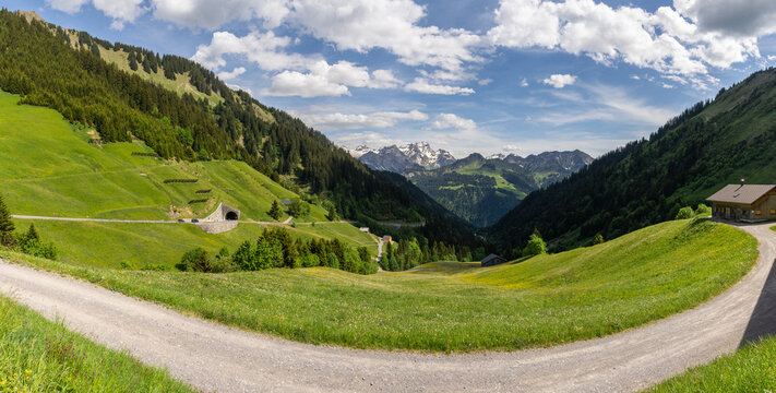 wonderful sight in the Grosswalsertal, clouds over the mountains in Austria, the view from Faschinajoch in Vorarlberg, Rote Wand (mountain called "the red wall") in the background