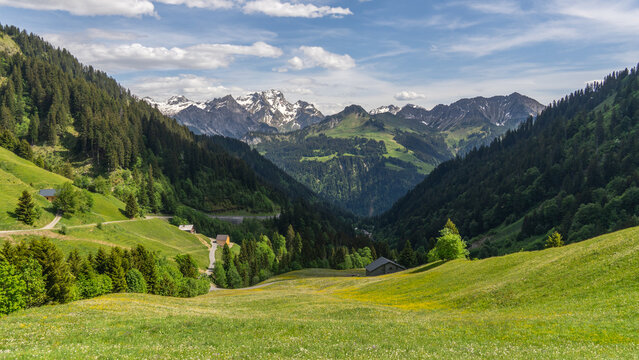 wonderful sight in the Grosswalsertal, clouds over the mountains in Austria, the view from Faschinajoch in Vorarlberg, Rote Wand (mountain called "the red wall") in the background
