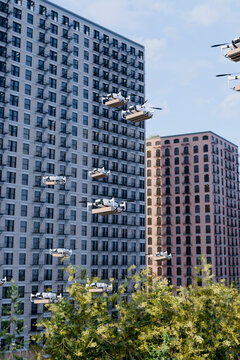 3D residential drone fleet carries parcels above city trees