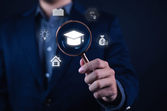 Education funding and scholarship search concept with business professional holding magnifying glass over graduation cap icon. Academic planning, student finance, learning opportunities and career dev