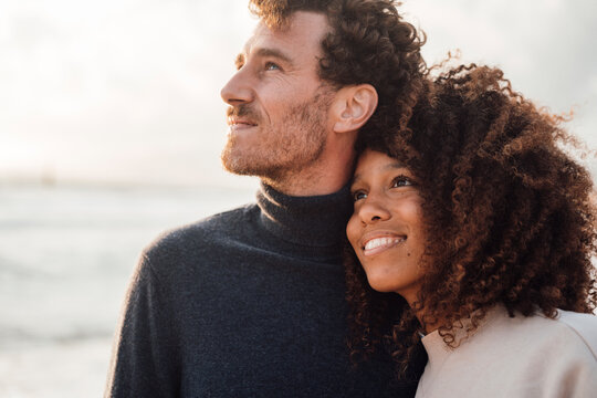 Happy loving couple spending time together at beach