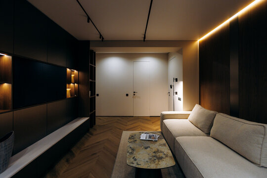 Modern living room interior with warm ambient lighting